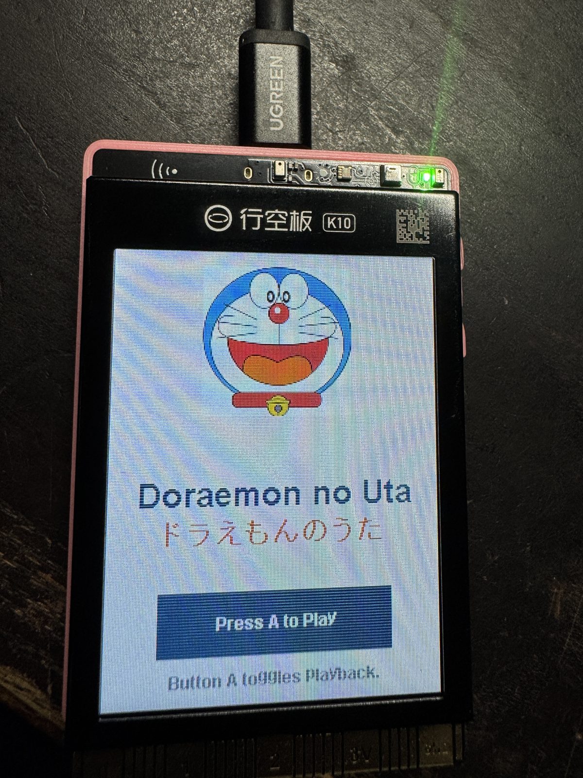 The chiptune player UI running on the K10